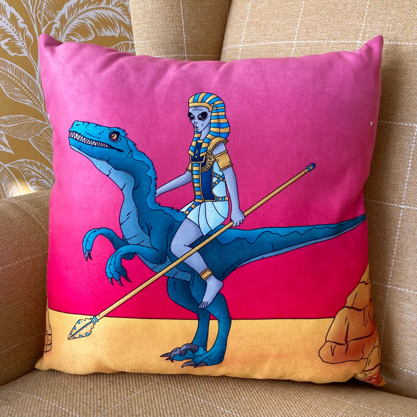 Ancient Alien riding a dinosaur cushion.